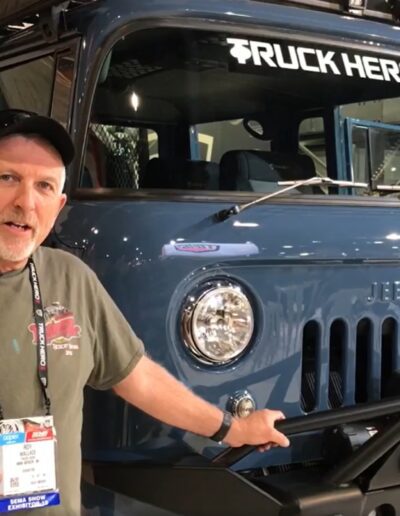 Roy Wallace and his Blue FC-170 talking to aFe Power at SEMA 2019