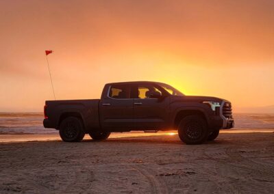 Silhouette of 2022 Toyota Tundra on Pismo beach at sunset