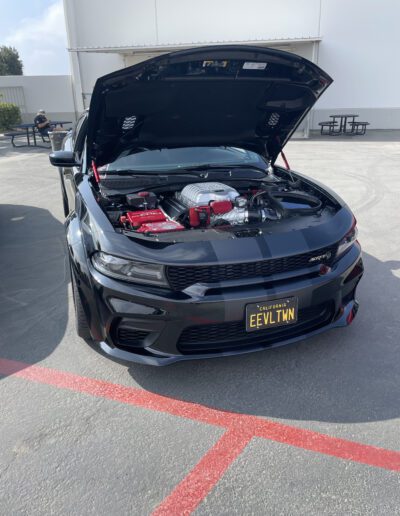 Black 2022 Dodge Charger SRT Hellcat Widebody with After Market AFE Intake at Car Show