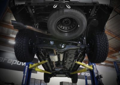 Underneath view of aFe aftermarket exhaust pipes of 2022 Toyota Tundra