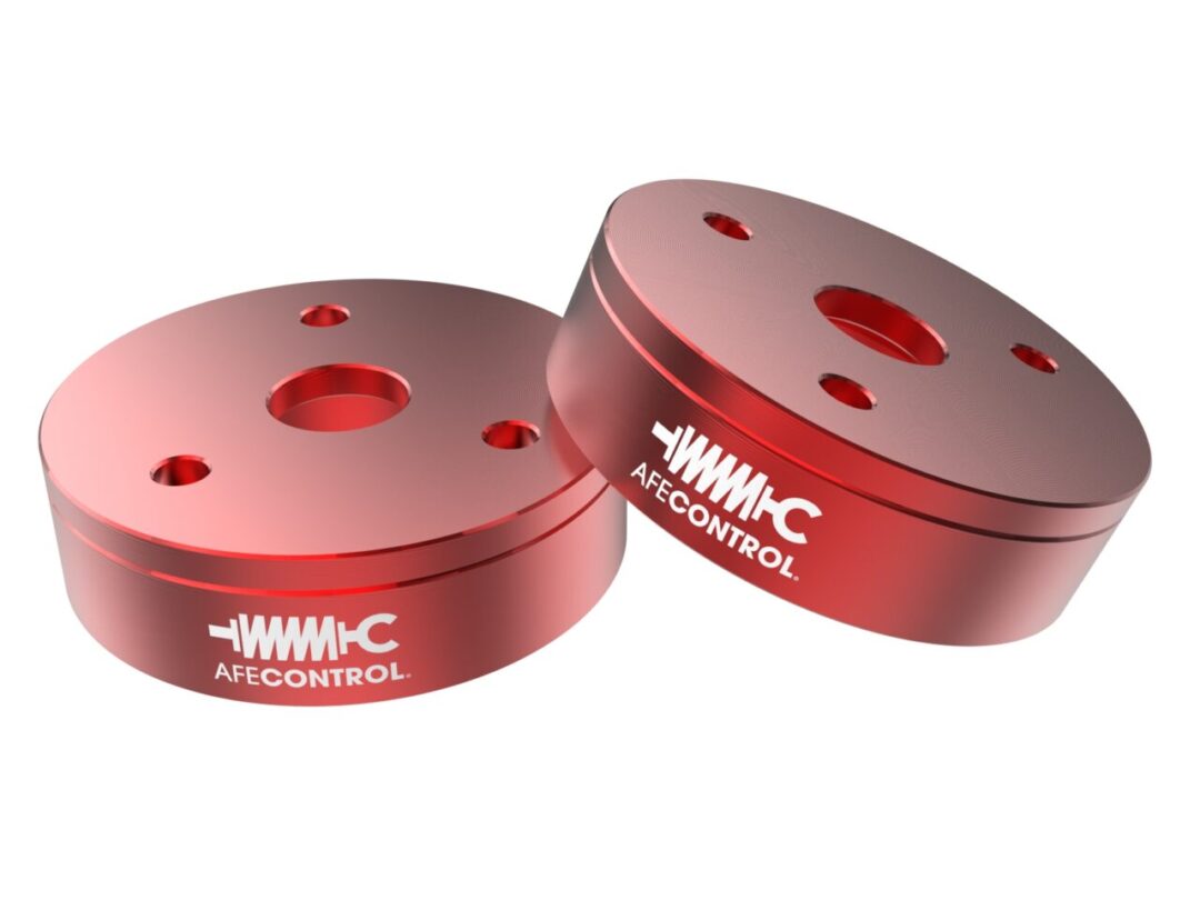 Product photo of two powder-coated red aFe Control Leveling spacers for 2022 RAM TRX on white background