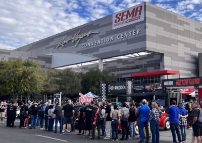 SEMA 2022 banner at busy Las Vegas Convention Center building entrance
