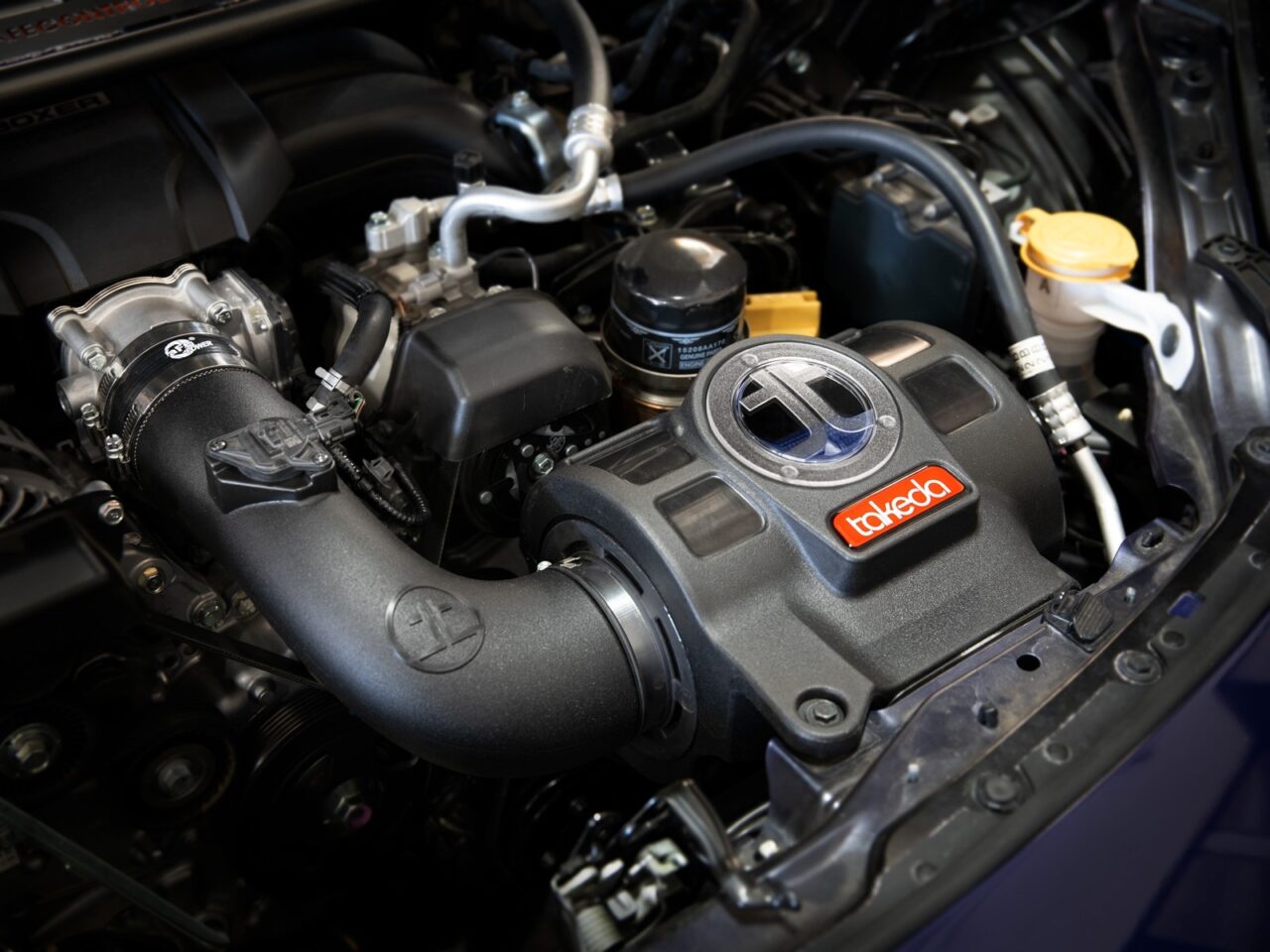 Aftermarket cold air intake kit installed on 2022 Toyota GR86 Engine