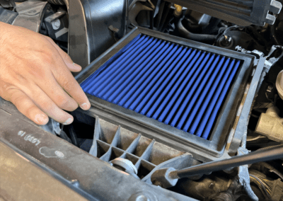 Drop-in rectangular blue oiled Pro 5R aFe air filter in stock airbox