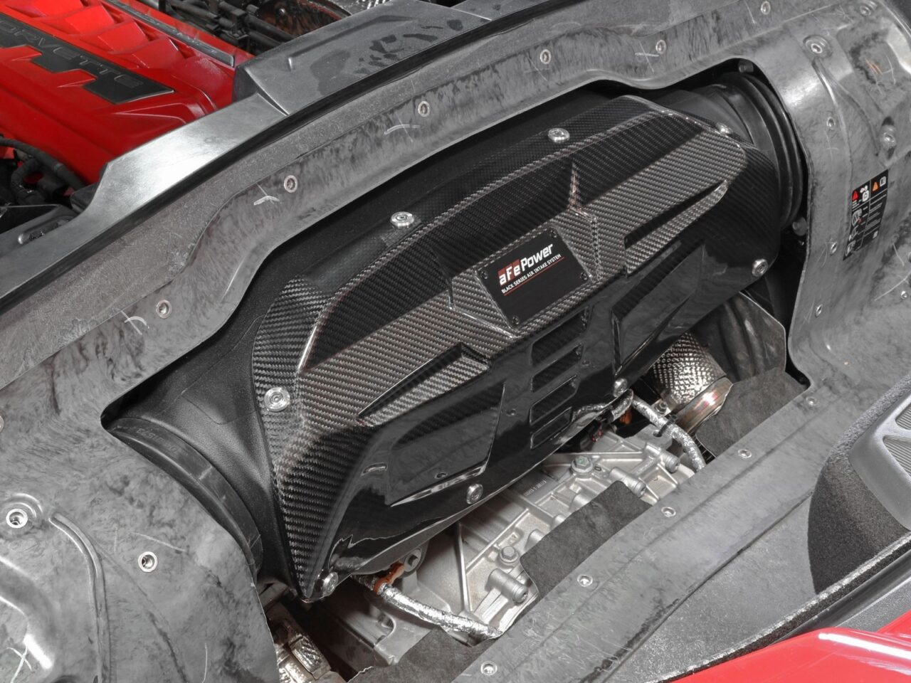 aFe POWER closed carbon fiber intake system installed under the hood of 2021 Chevy Corvette C8
