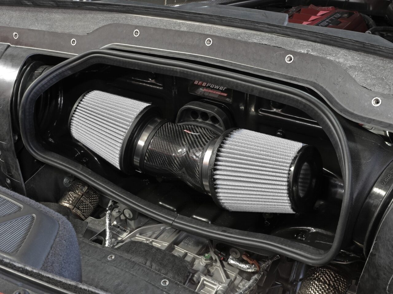 aFe intake kit with two grey dry air filters installed on a 2021 Chevy Corvette C8 engine