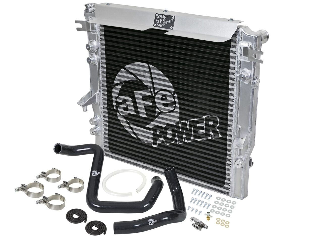Heavy-duty aftermarket aFe POWER radiator for Jeep Wrangler with radiator hoses and hardware on white background