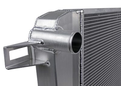 Close up of tube-and-fin design on aFe POWER aftermarket radiator upgrade for GM Diesel Trucks on white background