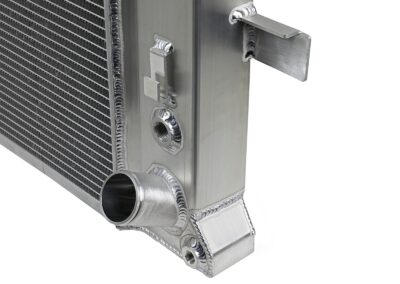 Close up of tube-and-fin design on aFe POWER aftermarket radiator upgrade for GM Diesel Trucks on white background