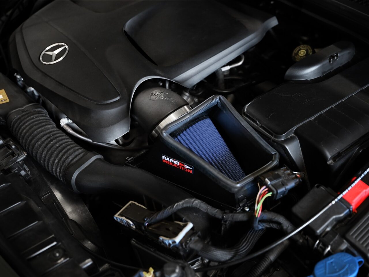 AFE Power aftermarket cold air intake with blue oiled filter installed on 2020 BENZ CLA GLA
