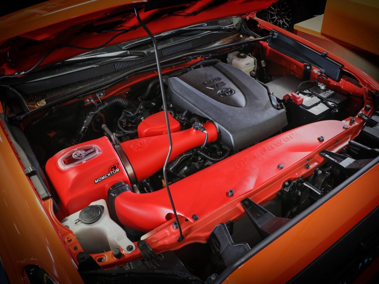 Red aFe Momentum cold air intake installed on 2019 Toyota Tacoma 3.4: engine 