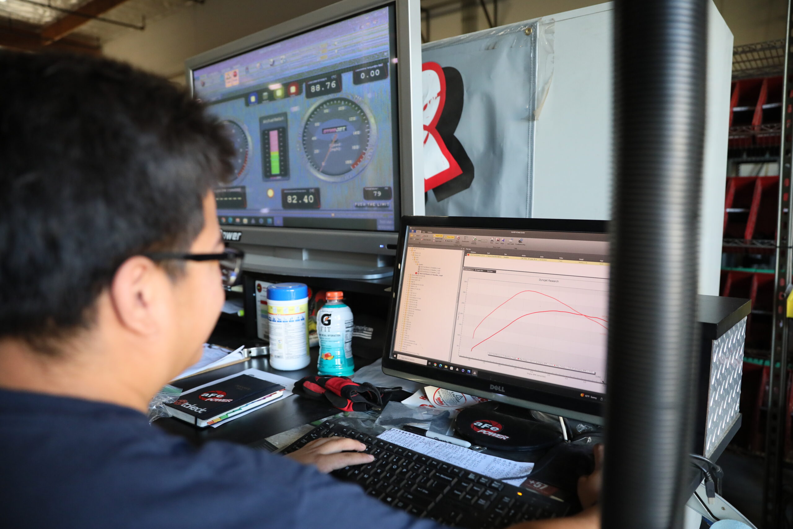 Tech reading dyno-jet screen on dyno testing