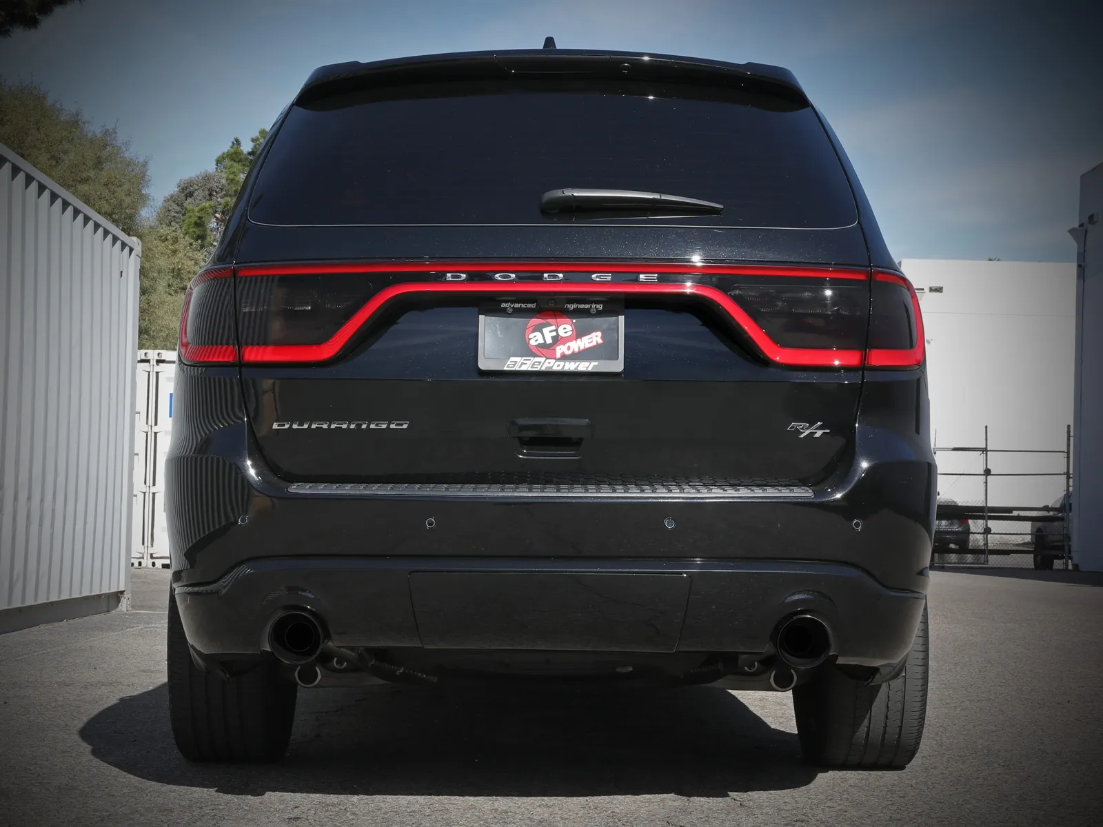 Rear of Black Dodge Durango R/T with aFe POWER cat-back exhaust installed with dual tips