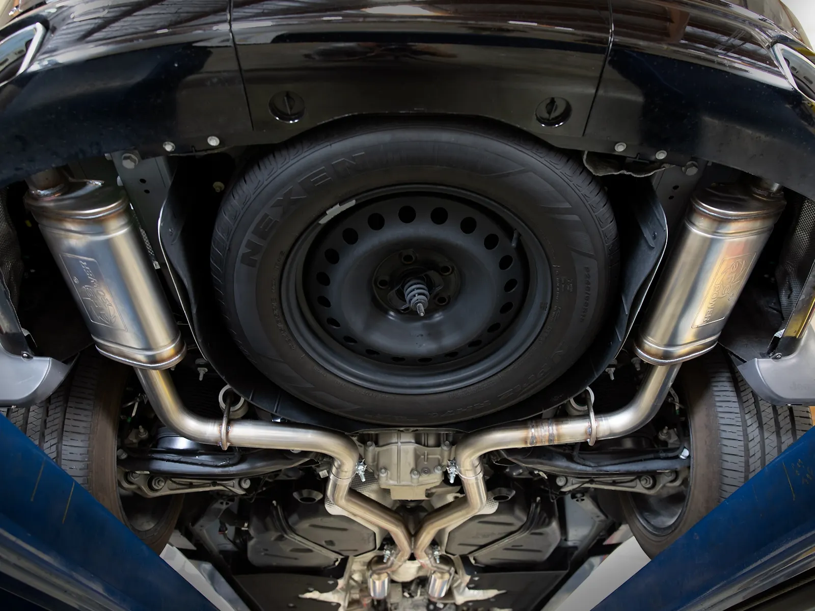 Underneath shot of aFe Cat-Back Exhaust installed on Jeep Grand Cherokee L (WL)