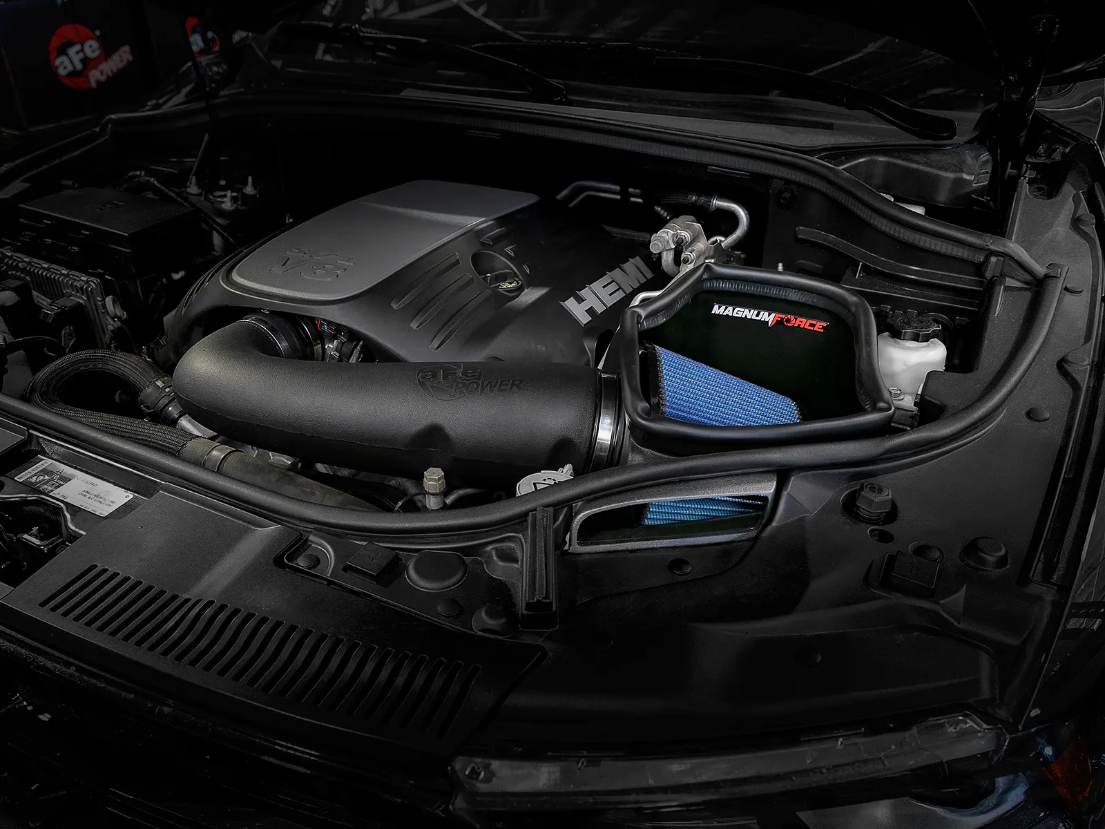 Open element aFe intake with big, blue exposed filter installed on V8 5.7-liter HEMI Grand Cherokee WK2