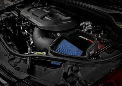 Open style aFe intake with big blue filter installed in V6 Grand Cherokee WK2