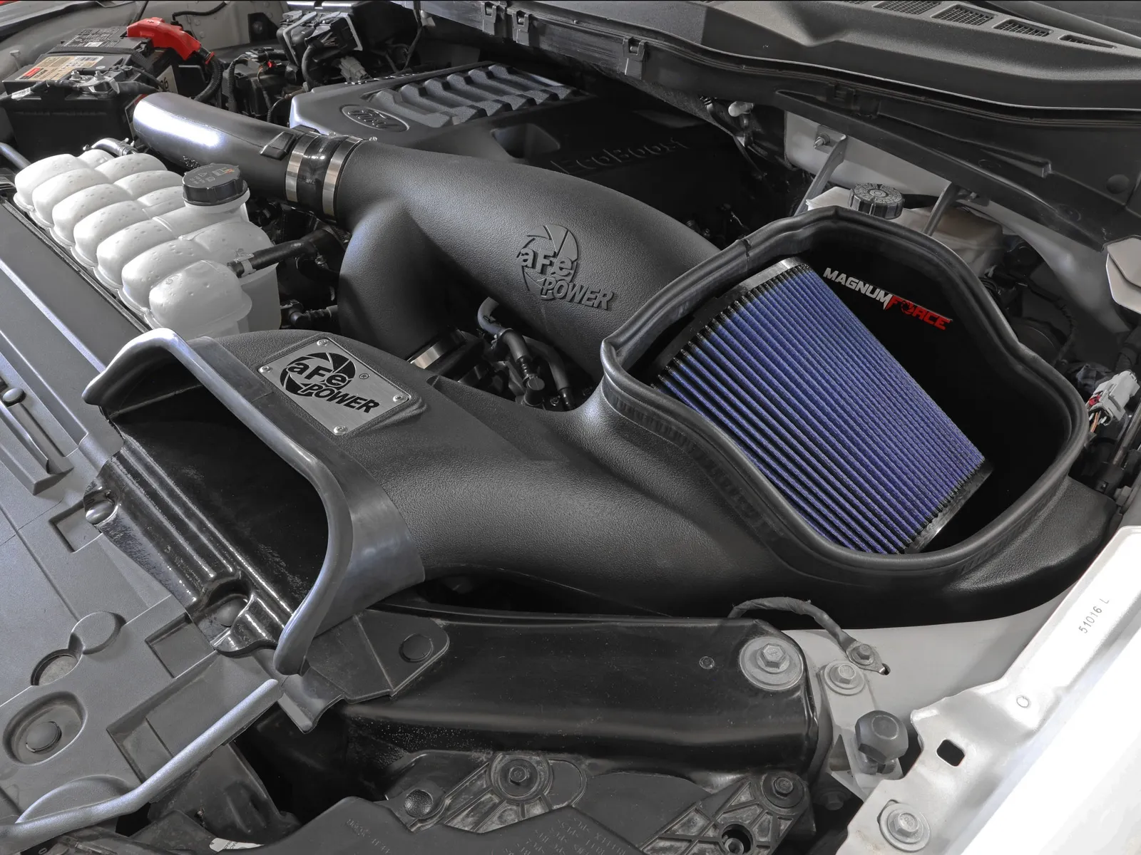 Open-element aftermarket intake with huge blue air filter and enlarged air scoop
