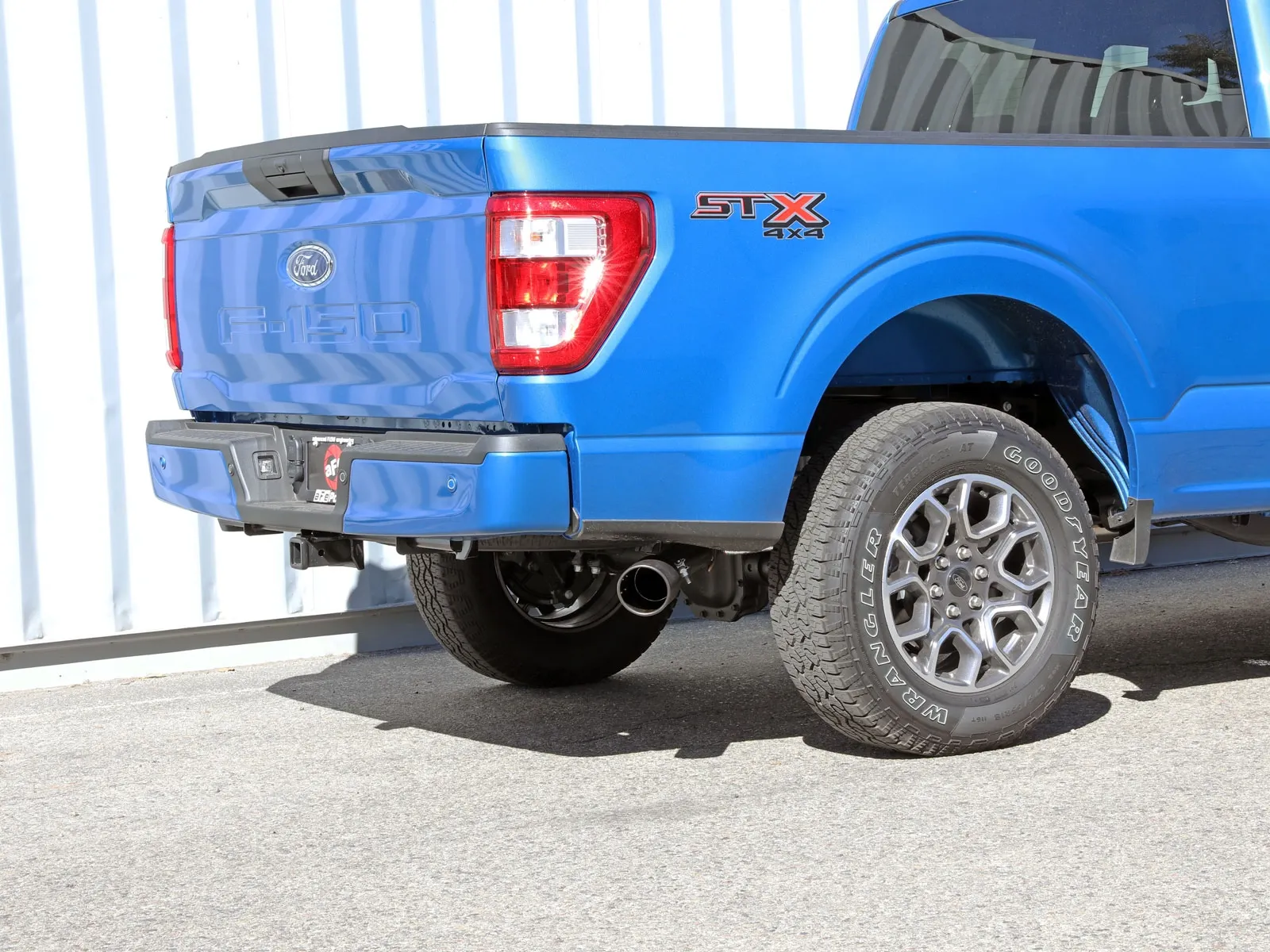 Blue Ford F-150 STX 4x4 rear with single exit aFe exhaust 