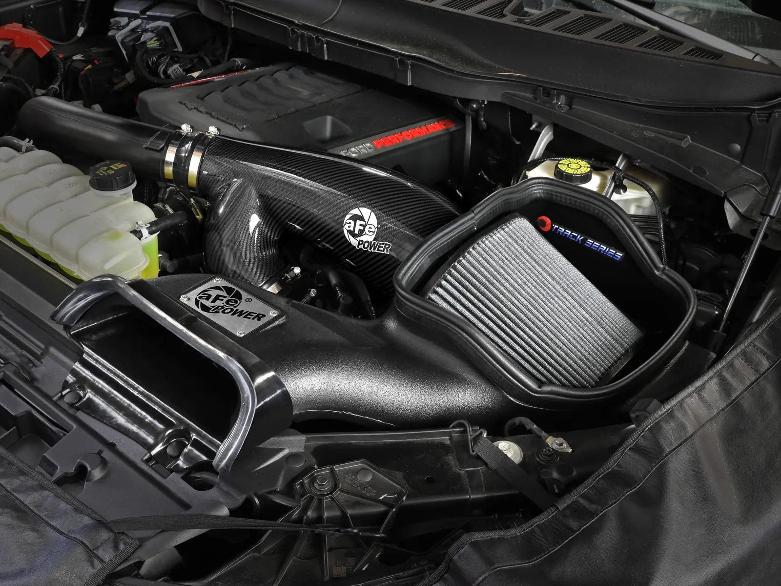 Black Carbon Fiber Tube on open element Track Series Intake with large grey filter installed on Gen 3 Raptor