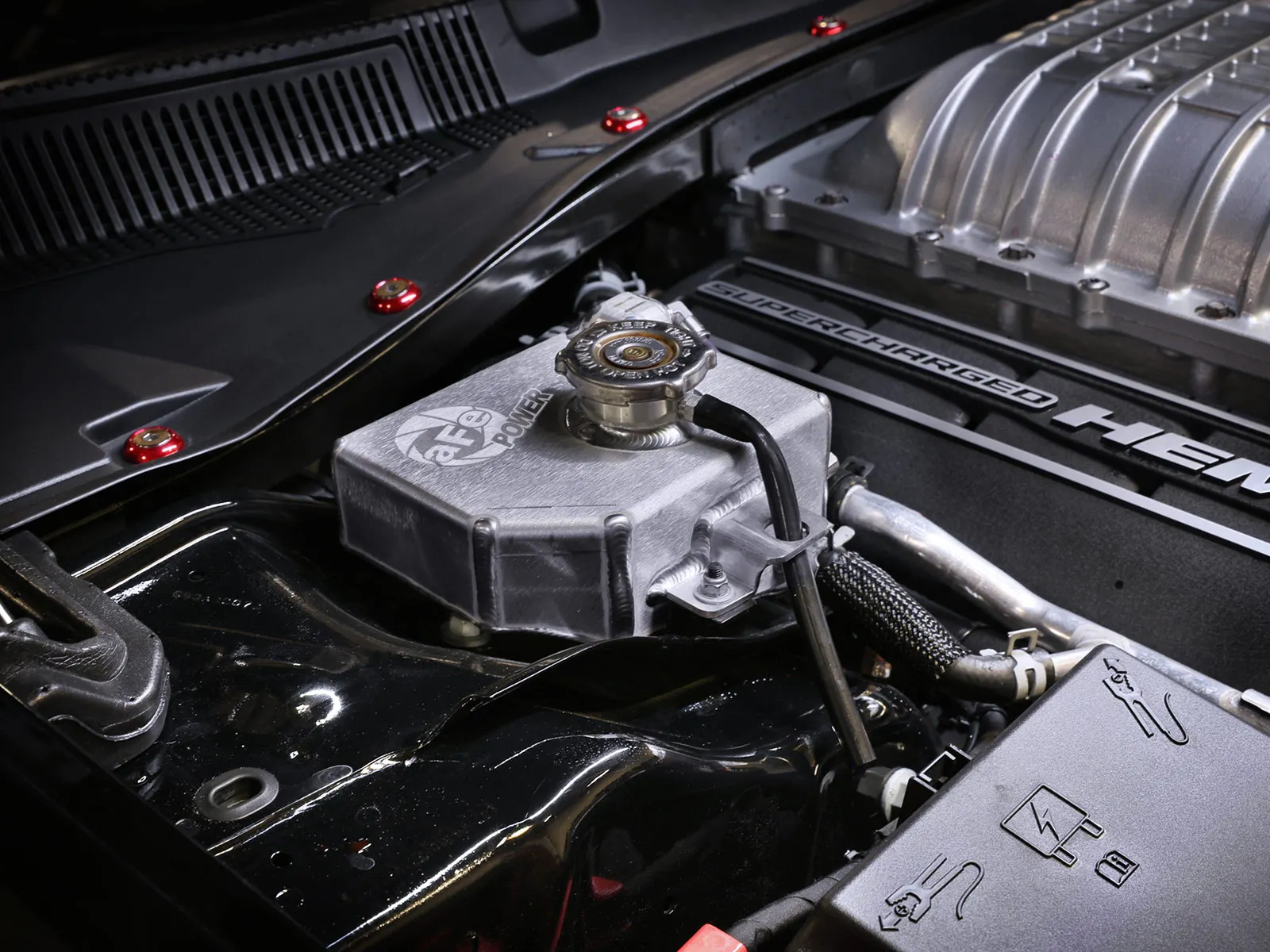 Aftermarket aFe Aluminum supercharger expansion tank installed on Dodge Challenger/Charger Hellcat