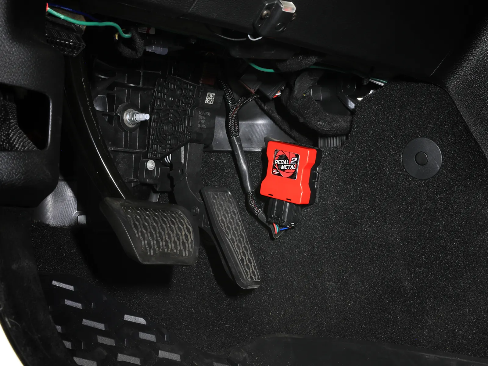F-150 Throttle Enhancer Red Pedal 2 Metal aFe module installed at pedal of Ford F-150
