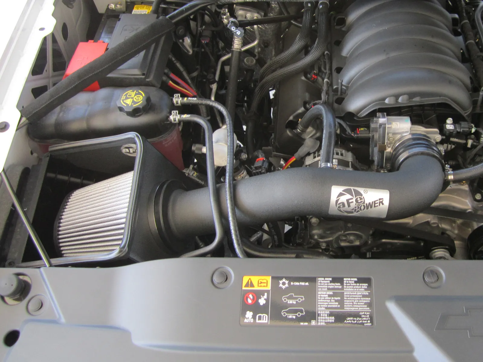 aFe Open style intake with grey air filter exposed and aFe tube installed on 14-19 Silverado 1500/Sierra 1500