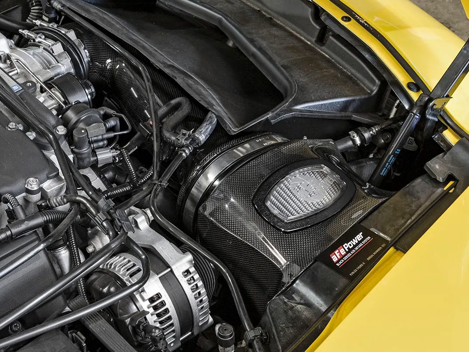 aFe POWER Carbon Fiber Black Series Cold Air Intake installed on yellow Chevy Corvette C7 Z06