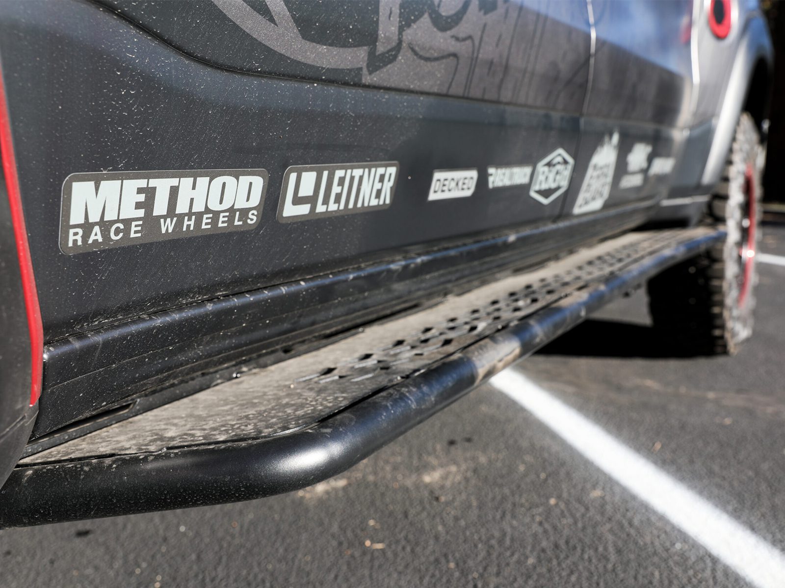 Ram-RHO-aFe-Off-road-Slider-Steps Close up of Dusty Rock slider steps on Ram RHO Overland build