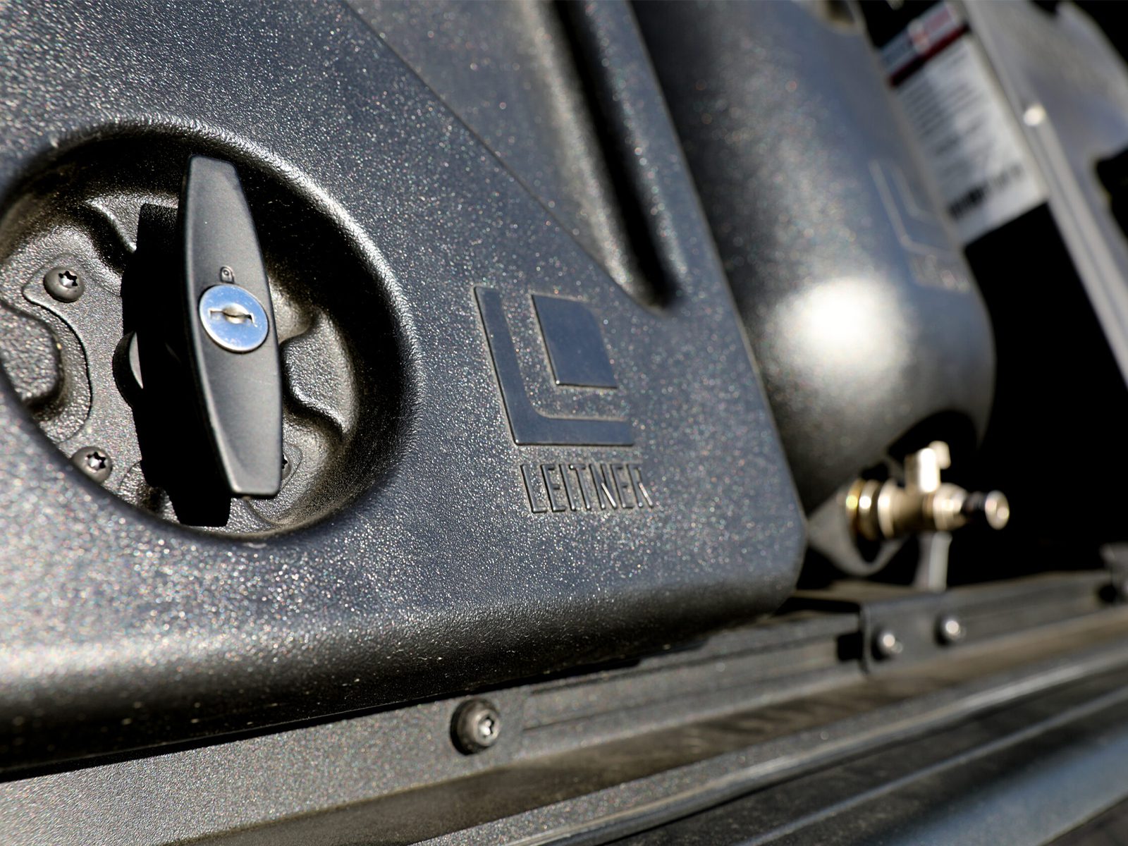 leitner-designs-rho-overland-build Close up on Leitner Design gear pod on bed of offroad built RAM 1500 truck