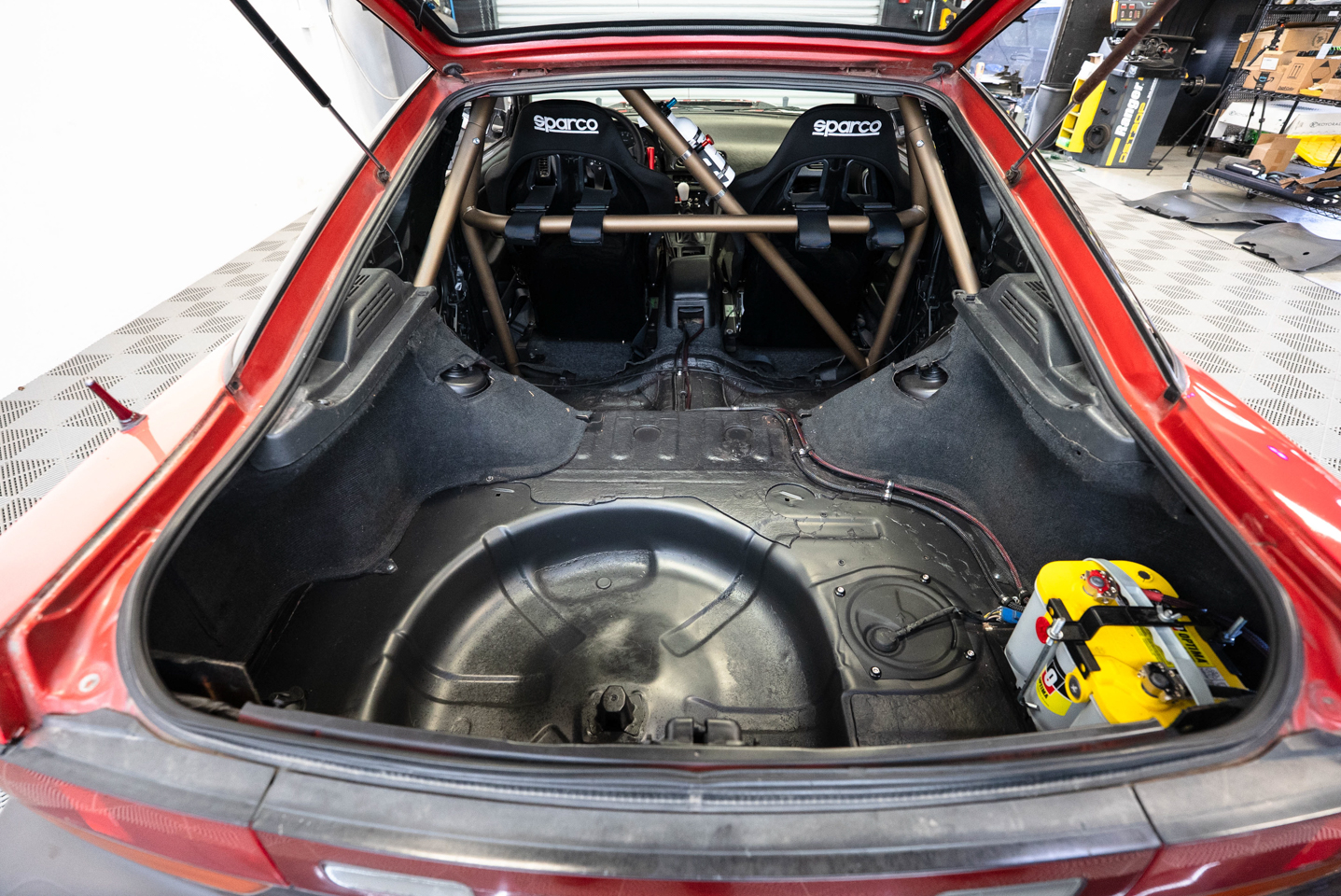 Nissan S13 240sx Drift Car rear trunk with Autopower Roll Cage and Sparco Seats and Optima Battery