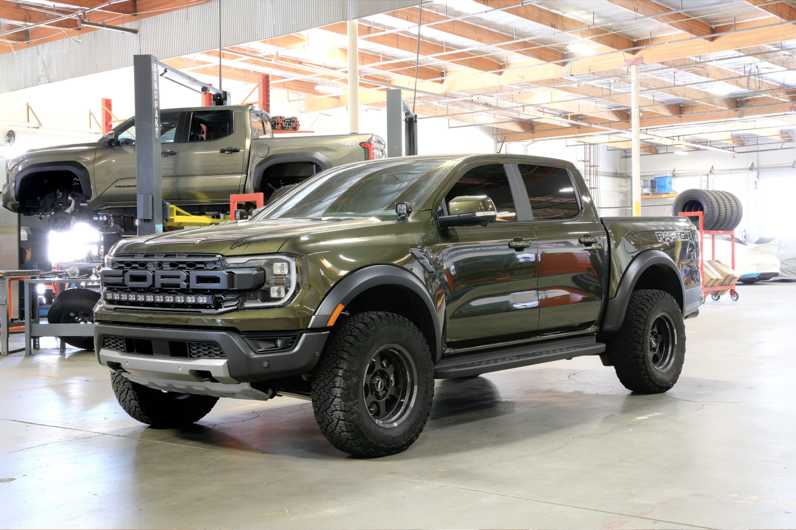 Green Ford Ranger Raptor in shop 