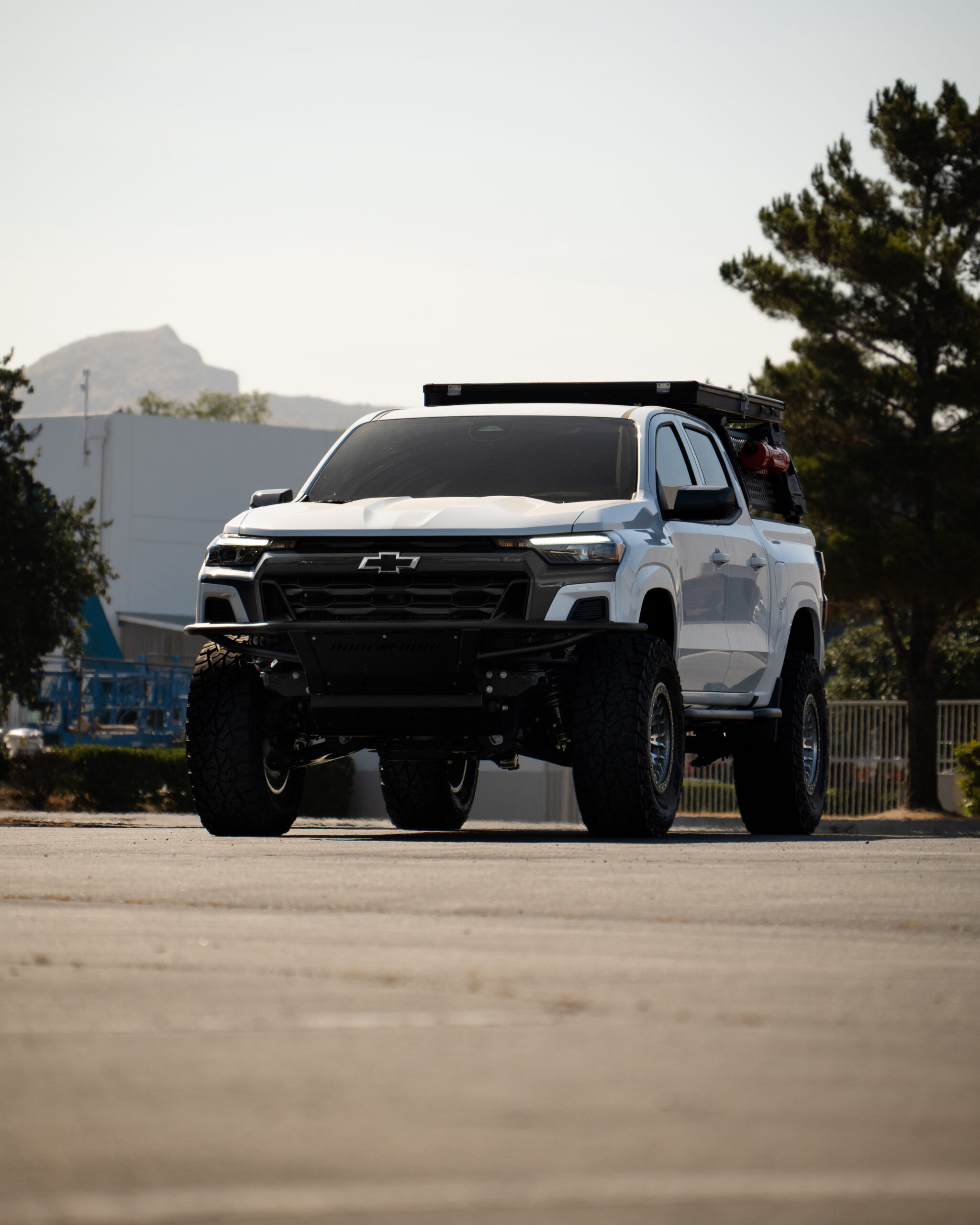 White Chevy Colorado lifted with 35