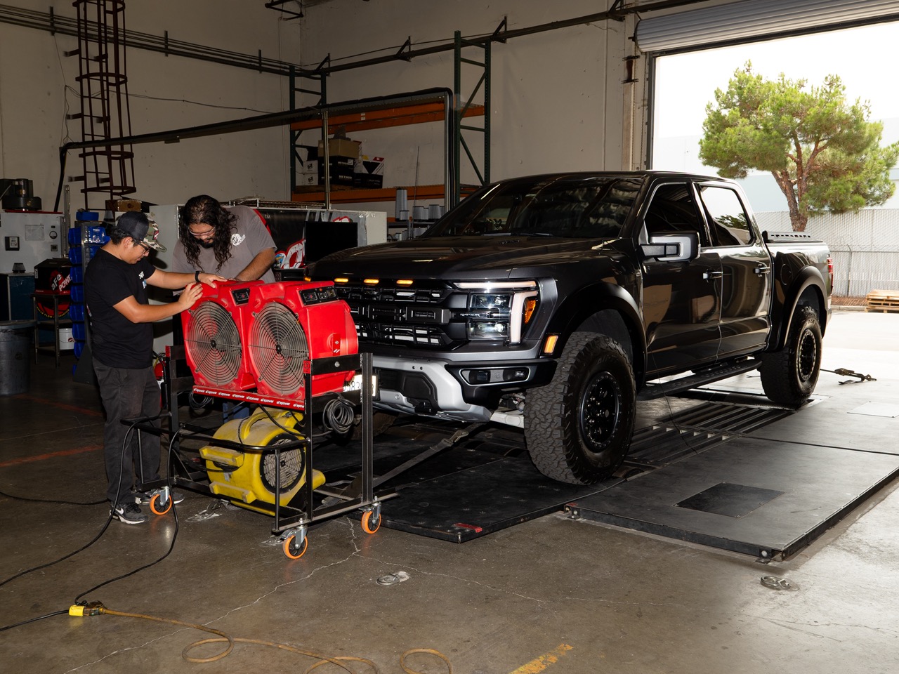 Adjusting fans in front of truck for dyno test