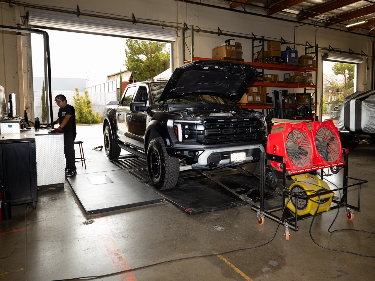 Ford F-150 Raptor Truck on dyno with fans in aFe POWER shop